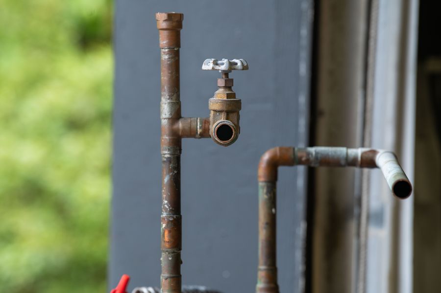 Severe grease and mineral scale buildup inside a drain pipe — Austin hard water accumulation