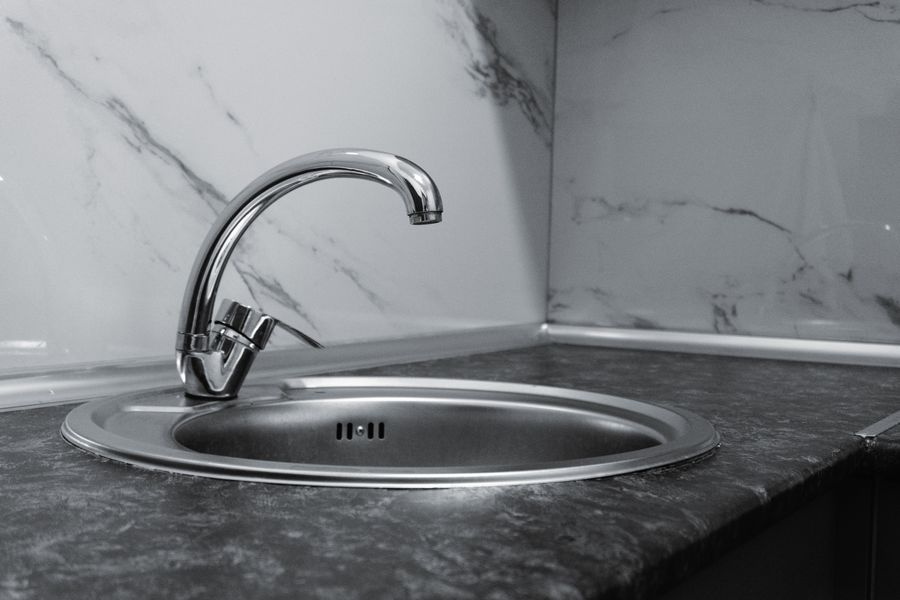 New kitchen faucet and braided stainless supply lines installed by SolidStreams Plumbing