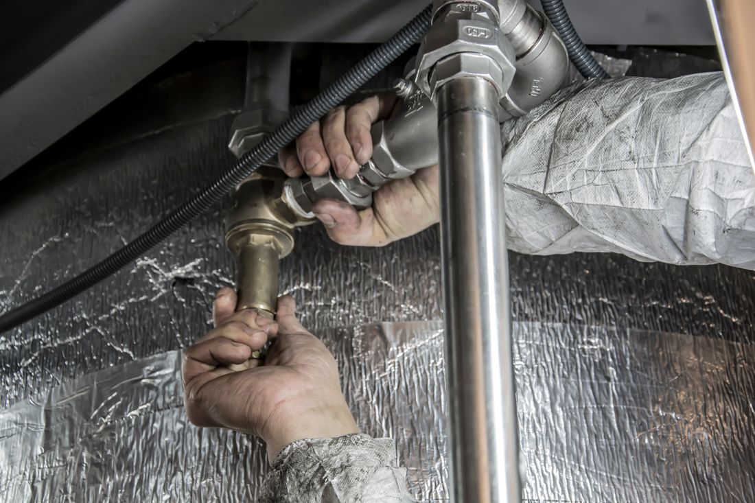 Professional plumber at work — SolidStreams Plumbing Austin